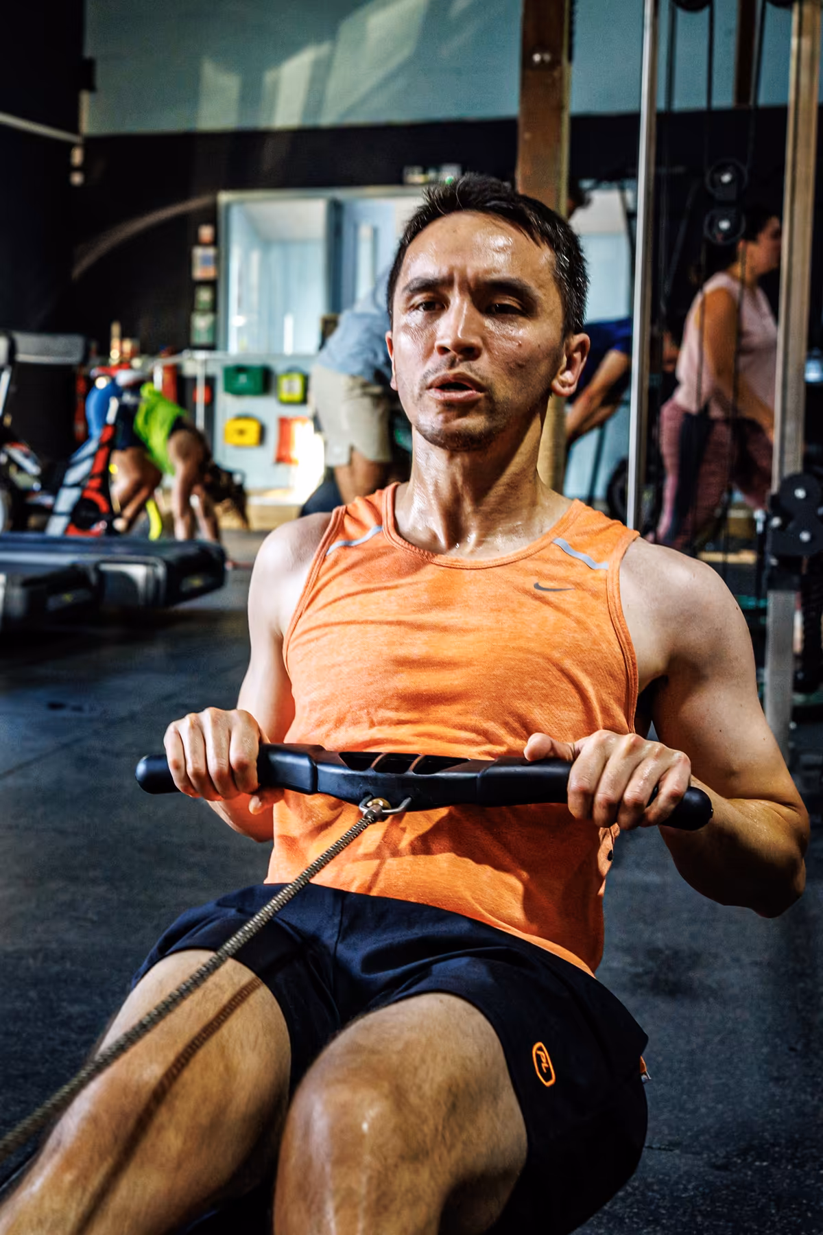 Member training on a rowing machine at Gymteq